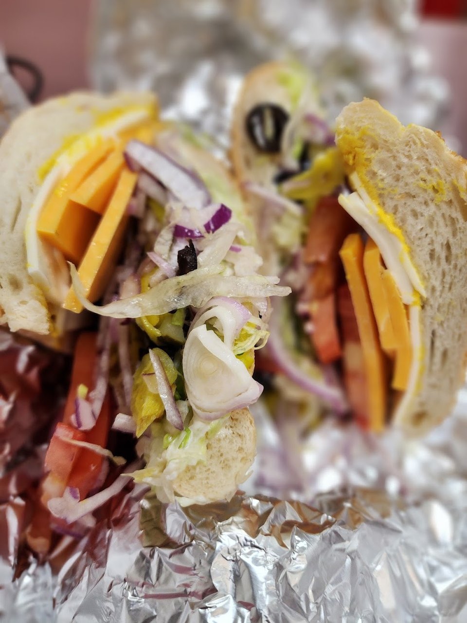 Printed menu for sandwiches and extra sides.