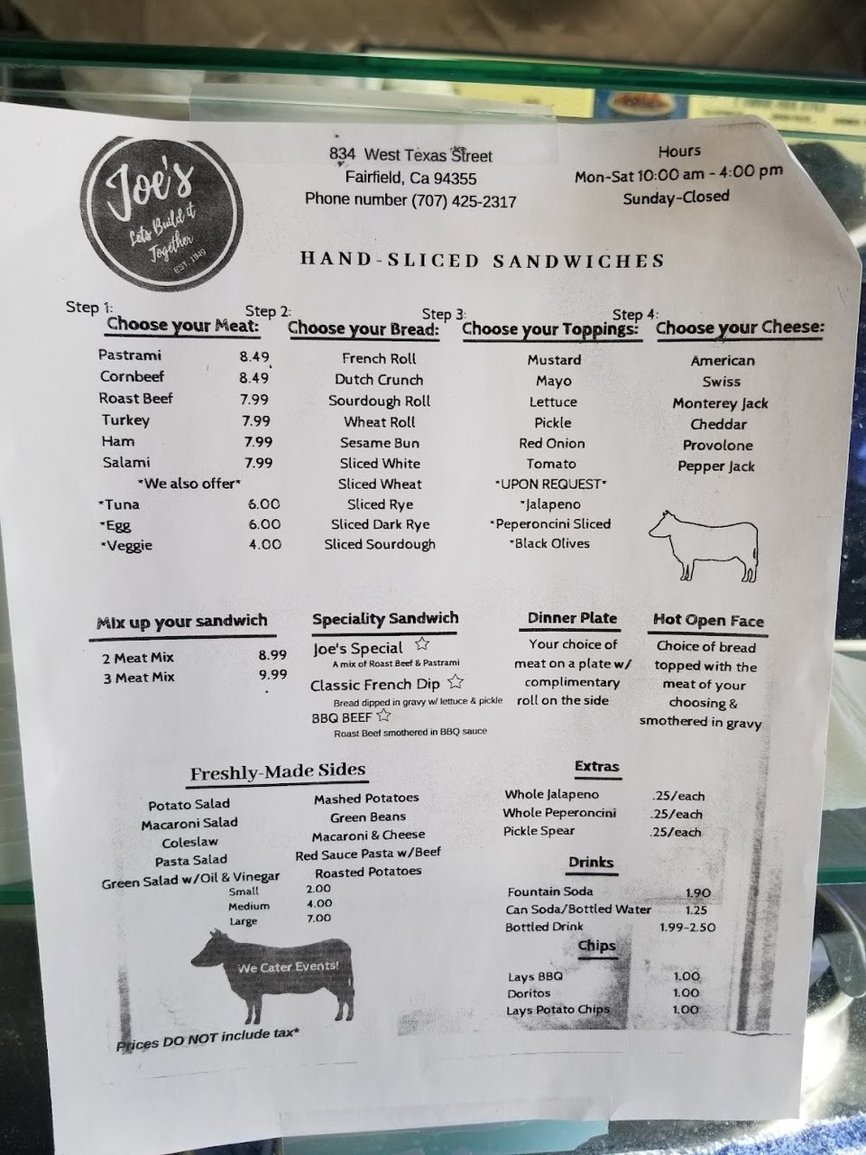 Printed menu for sandwiches and extra sides.